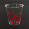 Water glass with red coral strand 